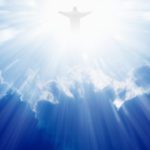 A man is standing in the sky with his arms outstretched.