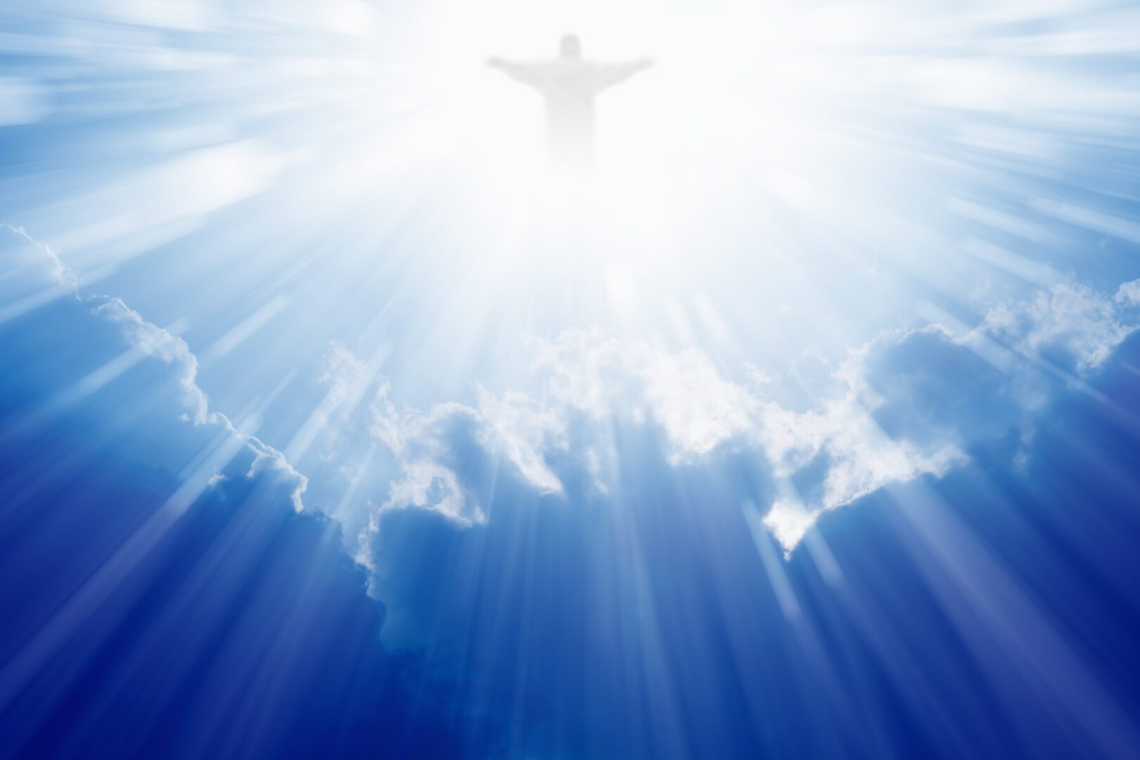 A man is standing in the sky with his arms outstretched.