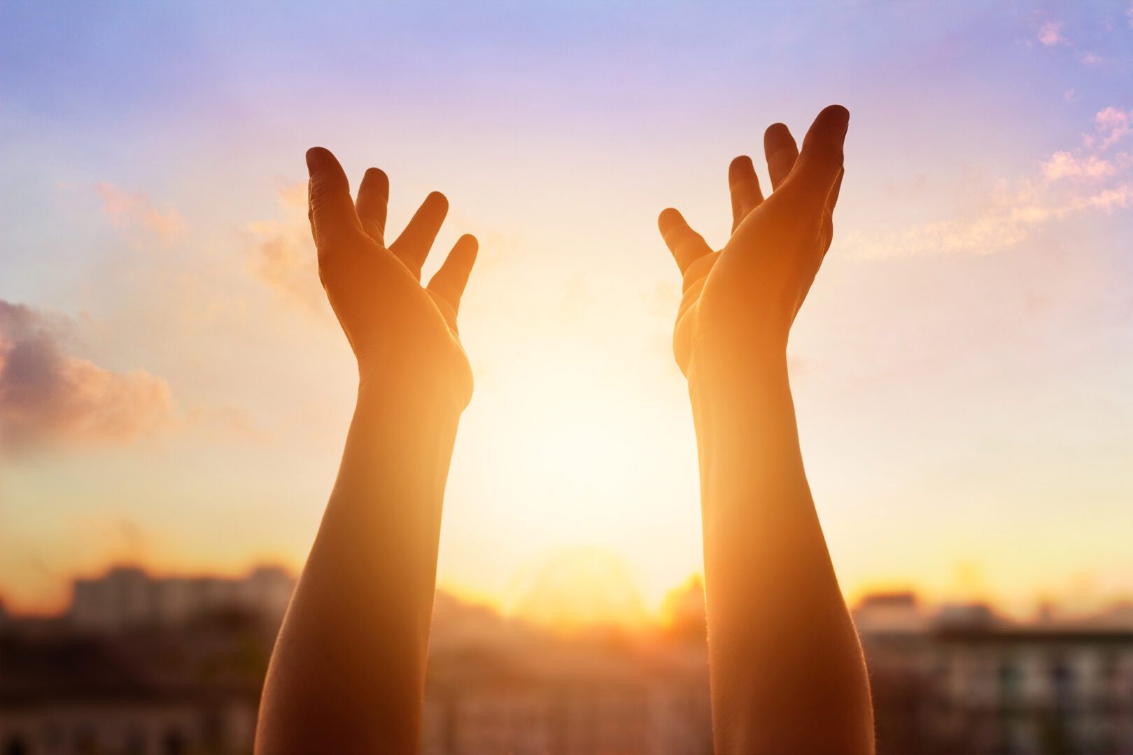 A person with their hands up in the air.
