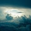 A cloud formation with the sun shining through.