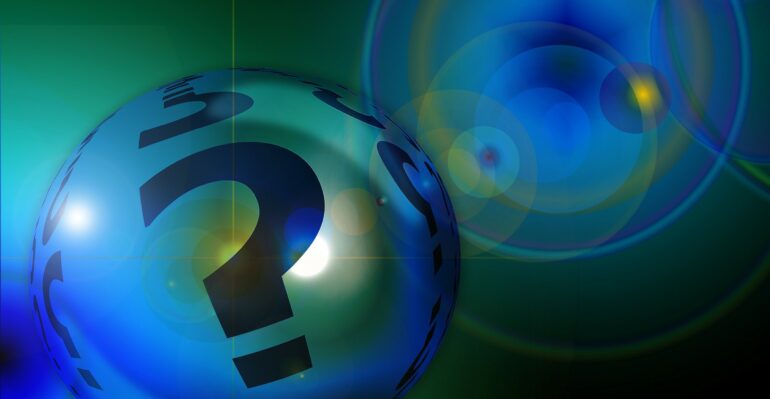 A question mark on a ball and some other balls