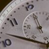 A close up of the face of an analog clock.