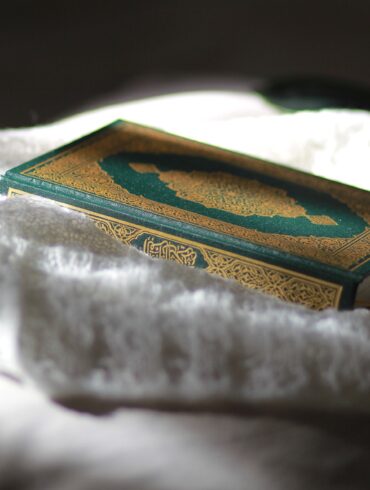A close up of a box on top of a bed