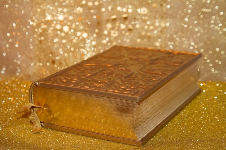 A wooden box with a gold background