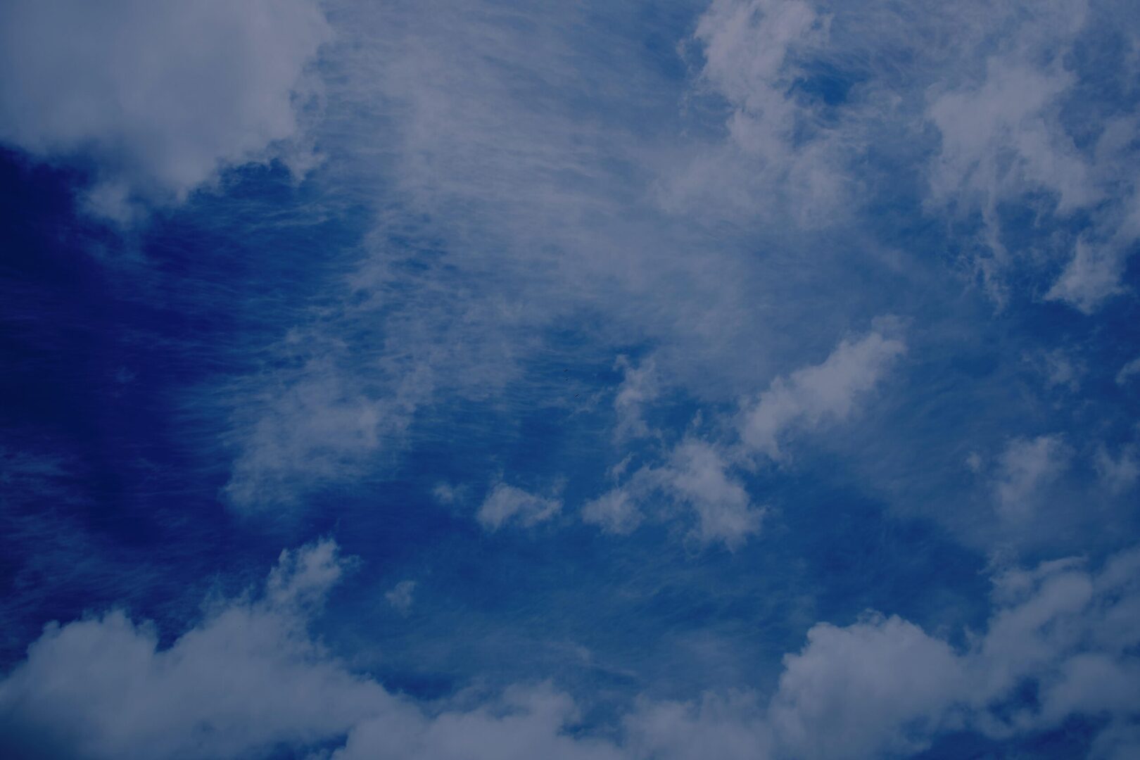 A blue sky with some clouds in it